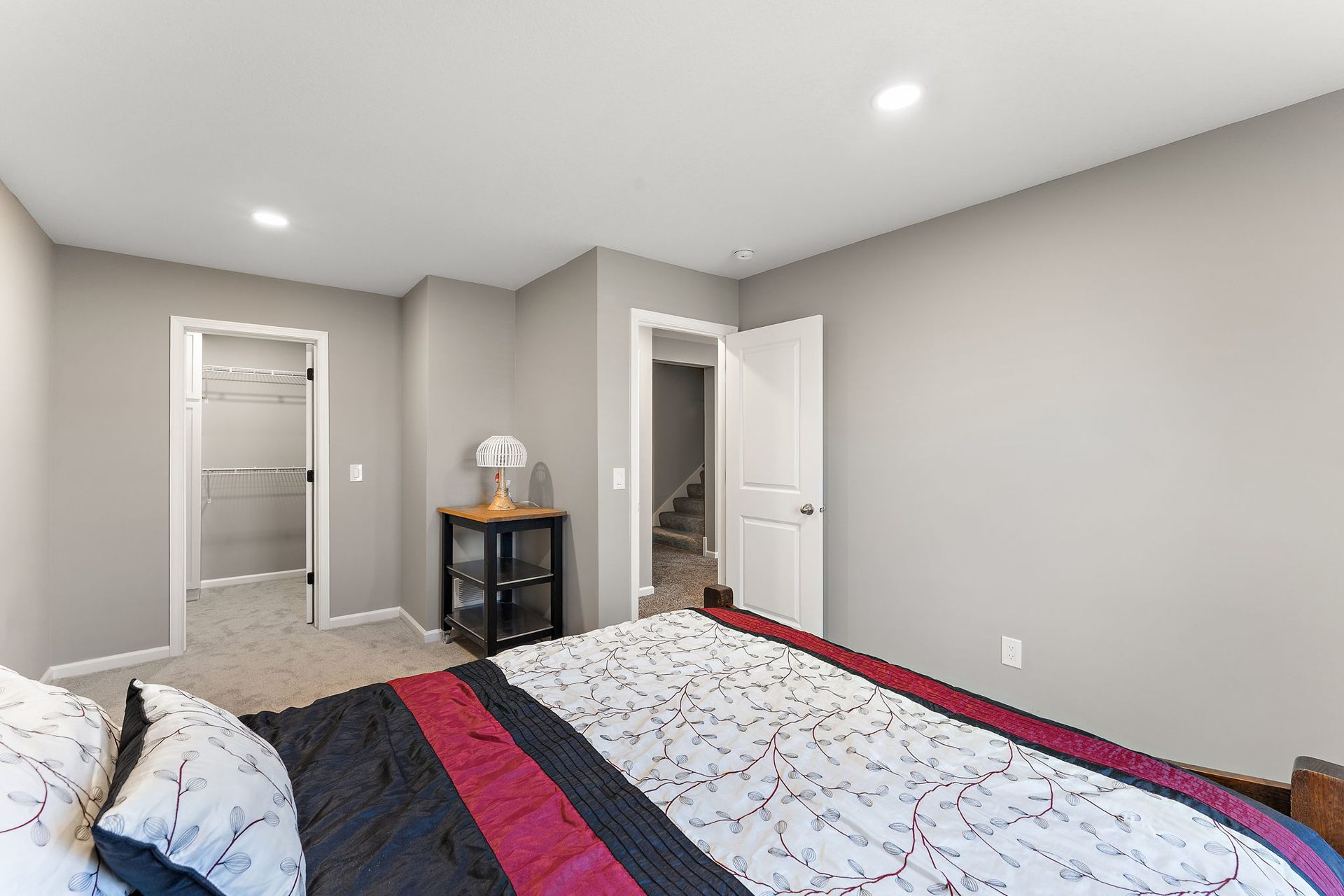 Bedroom with a built-in closet and a doorway through to the stair