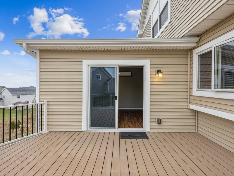 A composite deck with an aluminum guard, off a walkout door.